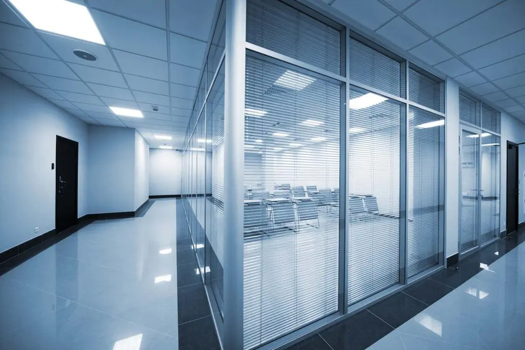 glass office partitions with bliinds